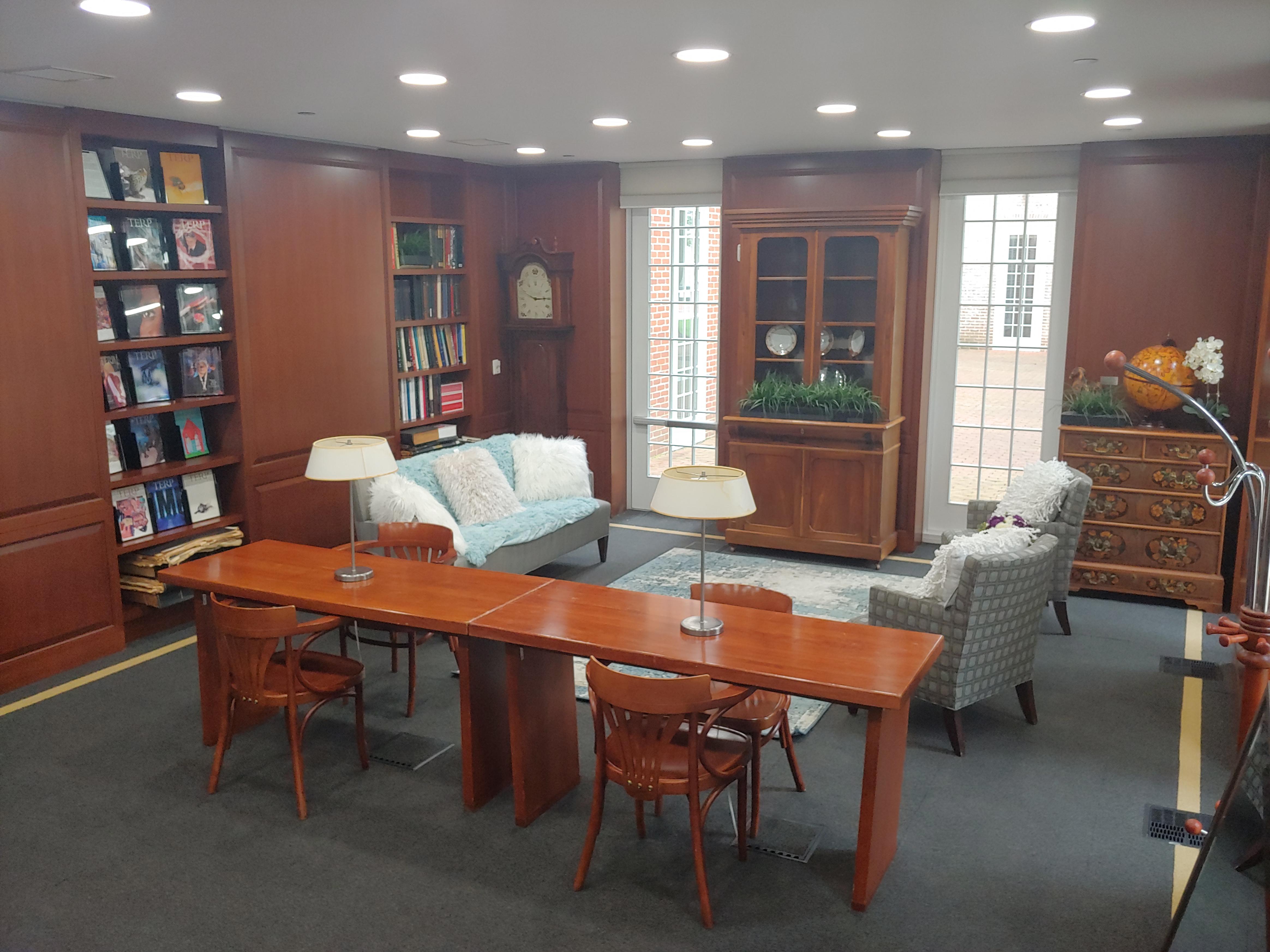 Library with couch and arm chairs and study desks