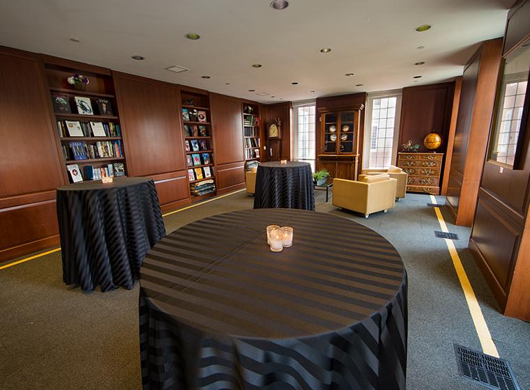 Library set with hightop tables covered with black striped linens